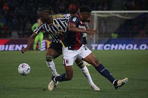 Jhon Lucumi and Samuel Illing-Junior battle for the ball